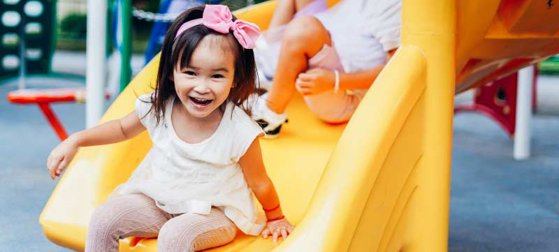 girl going down slide